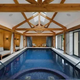 A beautiful shot of an indoor pool we completed for a private client in West Yorkshire. The combination of warm timber, minimalist stone, rich blue mosaics and natural light creates a wonderfully inviting space.

Interior Design - @one17design